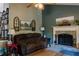 Cozy living room featuring a stone fireplace and rustic decor at 114 Summer Glen Pl, Dallas, GA 30157