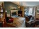 Cozy living room featuring a stone fireplace, hardwood floors, and comfortable seating at 114 Summer Glen Pl, Dallas, GA 30157