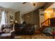 Living room featuring cozy furniture, stairs, and a Gathering photo gallery on the wall at 114 Summer Glen Pl, Dallas, GA 30157