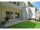 Backyard with patio, artificial turf, and fence, offering a private outdoor living space at 1575 Kilmington Ct, Alpharetta, GA 30009