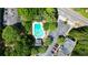 Aerial view of the Briargate community pool featuring a refreshing turquoise pool and plenty of surrounding greenery at 1575 Kilmington Ct, Alpharetta, GA 30009