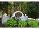 Elegant Briargate community sign surrounded by lush greenery and colorful flowers at 1575 Kilmington Ct, Alpharetta, GA 30009