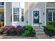 Inviting entryway with decorative wreath, fresh landscaping, and well-maintained front steps at 1575 Kilmington Ct, Alpharetta, GA 30009