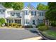 Charming townhome with manicured landscaping, black shutters, and convenient parking at 1575 Kilmington Ct, Alpharetta, GA 30009