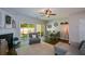 Cozy living room with a fireplace and sliding glass doors to the outdoor patio at 1575 Kilmington Ct, Alpharetta, GA 30009