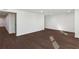 View of open basement featuring dark wood flooring and a clean, bright aesthetic with recessed lighting at 1721 Hortense Nw Pl, Atlanta, GA 30318