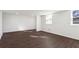 Spacious basement with updated dark wood flooring, recessed lighting, and windows for natural light at 1721 Hortense Nw Pl, Atlanta, GA 30318