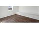 Finished basement featuring dark wood flooring and a built-in bench under the window at 1721 Hortense Nw Pl, Atlanta, GA 30318