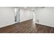Spacious finished basement with dark wood flooring, recessed lighting, and access to a bathroom at 1721 Hortense Nw Pl, Atlanta, GA 30318