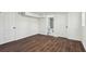 Finished basement with dark wood flooring and access to an updated bathroom at 1721 Hortense Nw Pl, Atlanta, GA 30318