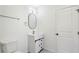 Bathroom featuring modern vanity with an oval mirror and a door at 1721 Hortense Nw Pl, Atlanta, GA 30318
