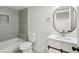 Bathroom featuring a modern vanity, tub, and updated tile at 1721 Hortense Nw Pl, Atlanta, GA 30318