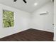 This bedroom features a modern ceiling fan, a window with a view, and a split AC unit at 1721 Hortense Nw Pl, Atlanta, GA 30318