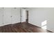 Cozy bedroom featuring two closets, dark wood flooring, and plenty of natural light at 1721 Hortense Nw Pl, Atlanta, GA 30318