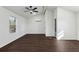 Bright bedroom featuring vaulted ceiling, ceiling fan, large window, and modern finishes at 1721 Hortense Nw Pl, Atlanta, GA 30318