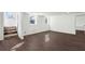 The bonus room boasts new floors, natural light, and access to the back entry and stairs at 1721 Hortense Nw Pl, Atlanta, GA 30318