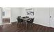 Modern dining room featuring stylish table and chairs, with hardwood flooring, and natural lighting at 1721 Hortense Nw Pl, Atlanta, GA 30318
