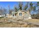 Beautiful stone home with a side entry garage, showcasing its unique architecture and well-maintained surroundings at 1721 Hortense Nw Pl, Atlanta, GA 30318