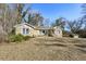 Single-story stone house with a well-kept front yard and white-columned porch at 1721 Hortense Nw Pl, Atlanta, GA 30318