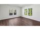 Bright living room featuring hardwood floors and multiple windows at 1721 Hortense Nw Pl, Atlanta, GA 30318