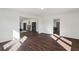 Open-concept living room featuring hardwood floors, abundant natural light, and a view into adjacent rooms at 1721 Hortense Nw Pl, Atlanta, GA 30318