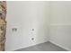 Room features a stone wall and speckled floors at 1721 Hortense Nw Pl, Atlanta, GA 30318