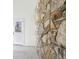 Interior room with stone wall and view of exterior door at 1721 Hortense Nw Pl, Atlanta, GA 30318