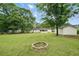 Beautiful backyard with a brick fire pit perfect for entertaining at 46 Forkwood Cir, Hiram, GA 30141