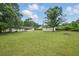 Large backyard featuring mature trees and plenty of space at 46 Forkwood Cir, Hiram, GA 30141