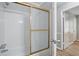 Bright bathroom featuring a glass shower door and modern finishes at 46 Forkwood Cir, Hiram, GA 30141