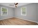 Bedroom with wood-look flooring, ceiling fan, and two windows that provide lots of natural light at 46 Forkwood Cir, Hiram, GA 30141