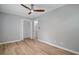 Bedroom with wood-look flooring, ceiling fan, closet, and fresh paint at 46 Forkwood Cir, Hiram, GA 30141