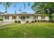 Charming single-story home with a well-manicured lawn and inviting front porch at 46 Forkwood Cir, Hiram, GA 30141