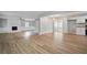 Spacious open-concept living space with hardwood floors, fireplace, and modern lighting at 46 Forkwood Cir, Hiram, GA 30141