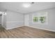 Bright and airy living space with a door, large window, and neutral wall colors at 46 Forkwood Cir, Hiram, GA 30141