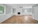 Spacious living room with fireplace, wood-look flooring, wainscoting, and windows that provide great natural light at 46 Forkwood Cir, Hiram, GA 30141