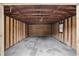 An interior shot of a storage shed showing unfinished walls, cement floor, and ample room for storage or workshop at 46 Forkwood Cir, Hiram, GA 30141