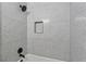 Modern bathroom showcasing designer tile shower with built-in niche and black fixtures at 2590 Eastwood Dr, Decatur, GA 30032
