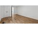 Bedroom with hardwood floors, closet with double doors, and white walls at 2590 Eastwood Dr, Decatur, GA 30032