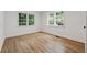 Bedroom with hardwood floors and natural light from two large windows at 2590 Eastwood Dr, Decatur, GA 30032