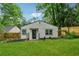 Charming single-story home with well-manicured lawn, garden beds, and cozy front entrance at 2590 Eastwood Dr, Decatur, GA 30032