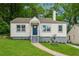 Charming home with freshly cut lawn and inviting front porch at 2590 Eastwood Dr, Decatur, GA 30032