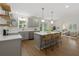 Modern kitchen boasts stainless steel appliances, a center island, and pendant lighting at 2590 Eastwood Dr, Decatur, GA 30032