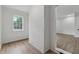 Bright room with hardwood floors, white brick wall, and wainscoting at 2590 Eastwood Dr, Decatur, GA 30032