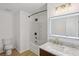 Modern bathroom boasts marble countertops, an LED mirror, and a shower-tub combo at 2864 Vining Ridge Ter, Decatur, GA 30034