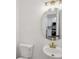 Stylish half-bathroom with modern fixtures and adjacent kitchen view at 2864 Vining Ridge Ter, Decatur, GA 30034