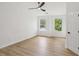 Bright bedroom features neutral walls, hardwood floors, a ceiling fan and great natural light at 2864 Vining Ridge Ter, Decatur, GA 30034