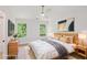 Staged bedroom features modern decor, natural light, and hardwood floors at 2864 Vining Ridge Ter, Decatur, GA 30034