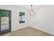 Dining room with modern lighting fixture and view to fenced backyard at 2864 Vining Ridge Ter, Decatur, GA 30034