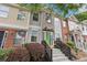 Charming townhome exterior featuring a welcoming front porch and well-maintained landscaping at 2864 Vining Ridge Ter, Decatur, GA 30034